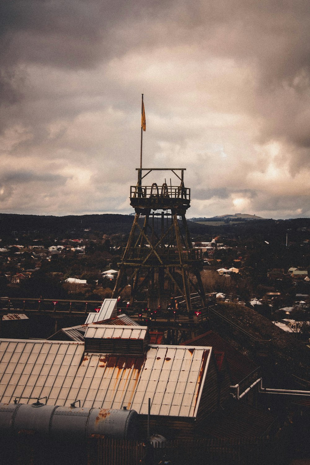 a tall tower with a flag on top