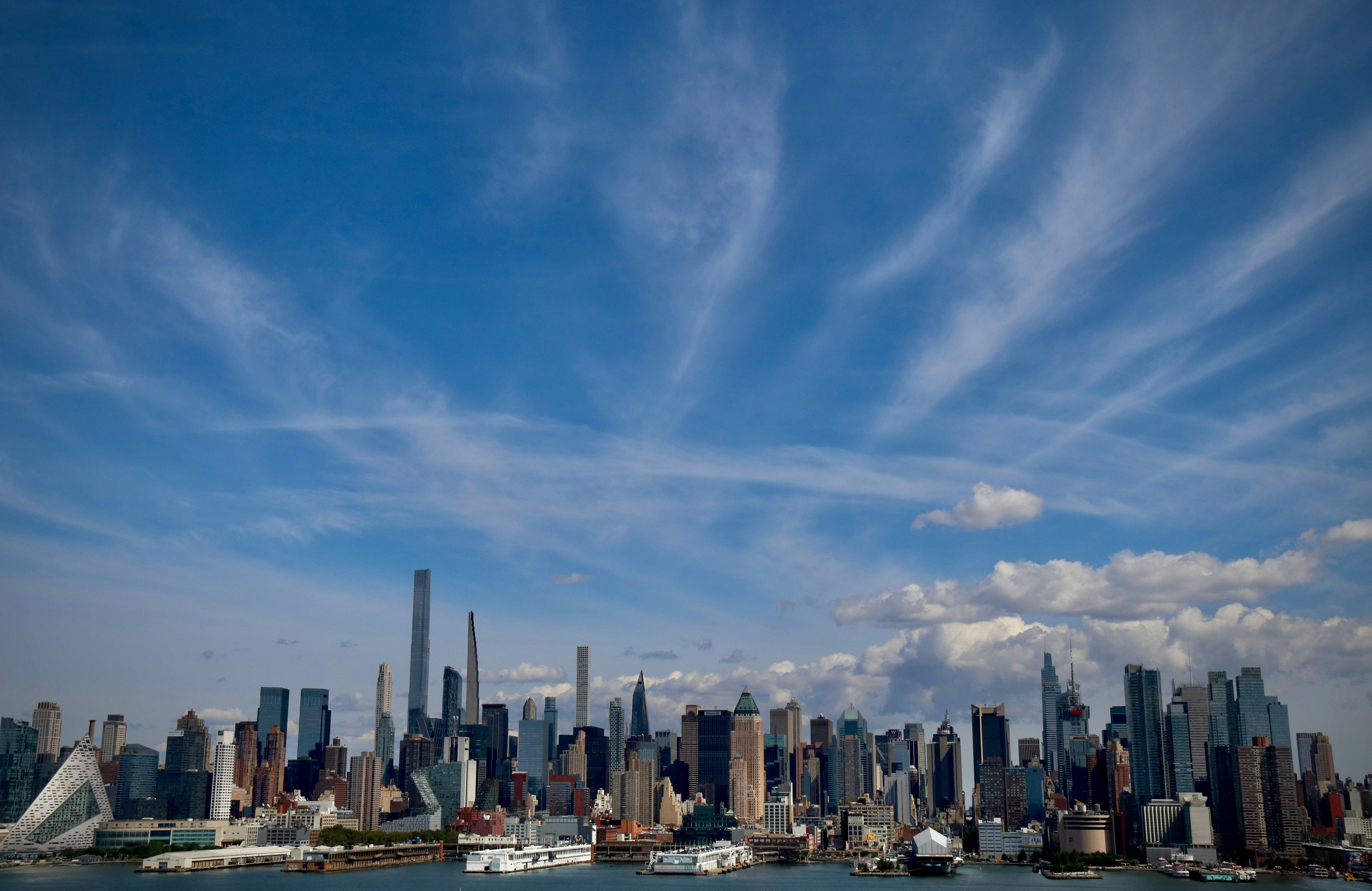 a city skyline with boats