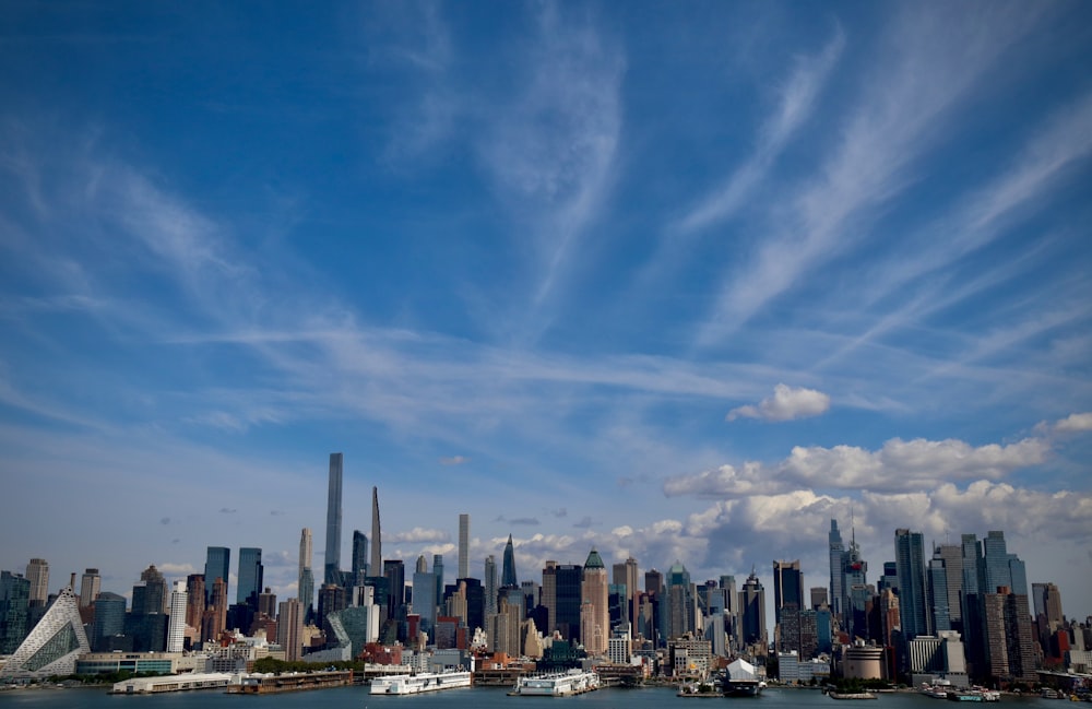 a city skyline with boats