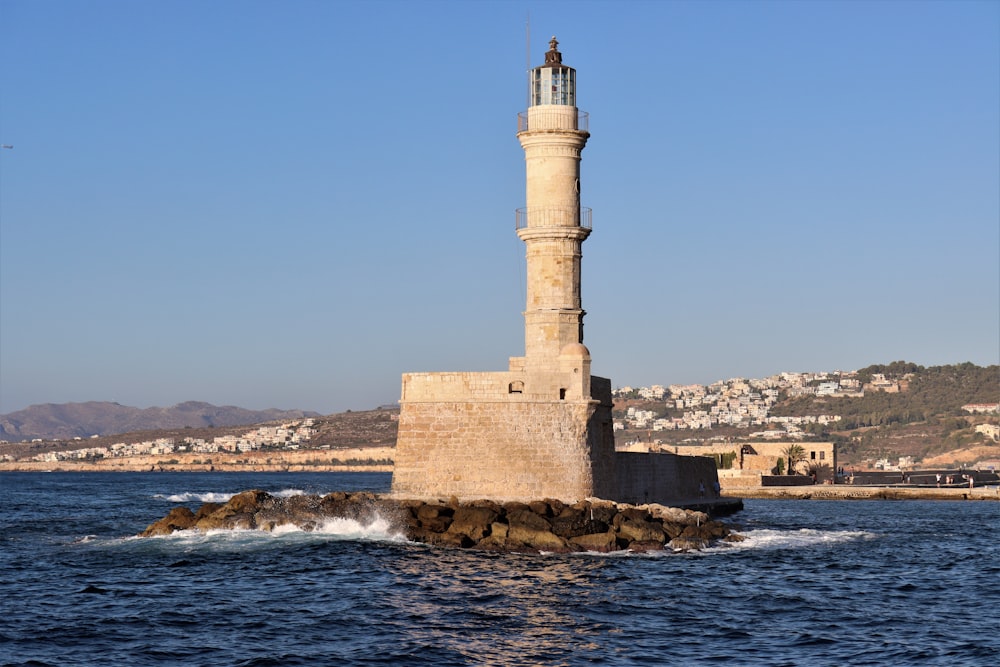 a lighthouse on a rocky island