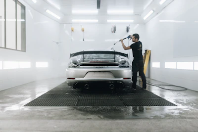 a person standing next to a car