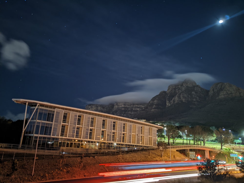 a building with a mountain in the background