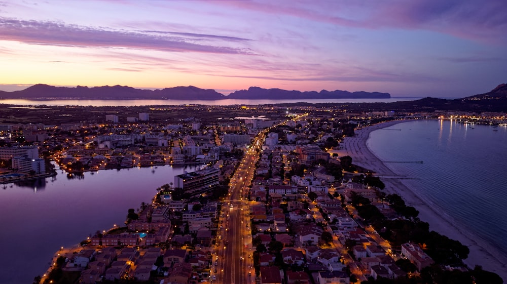 a city with lights on the water