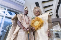 a man and woman wearing traditional clothing