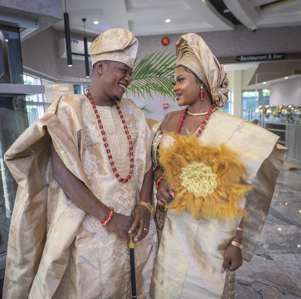 a man and woman wearing traditional clothing