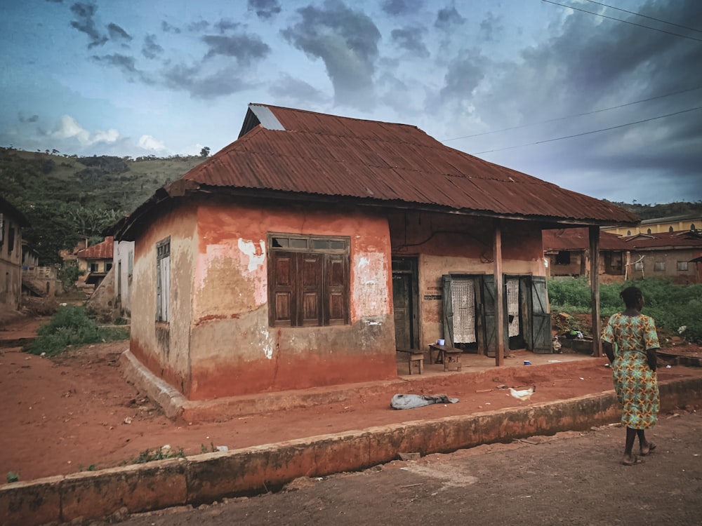 a person standing outside a house