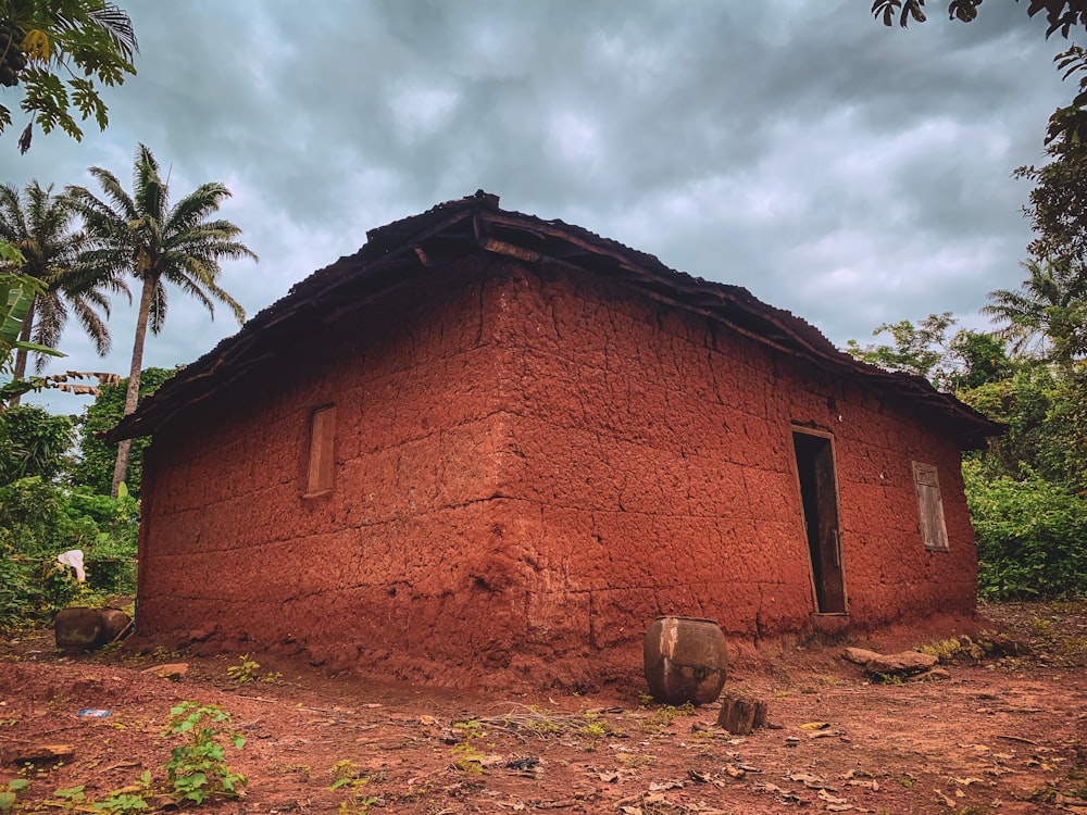 a red house with a stone roof