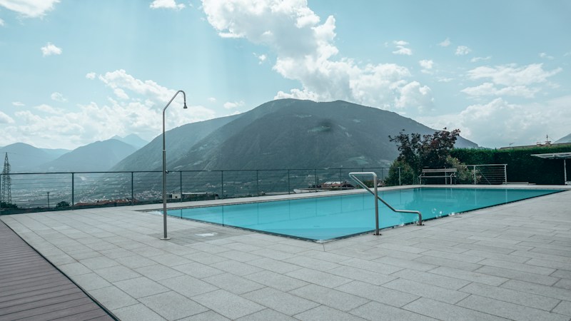 Luxury backyard pool with mountains in the background, like the Red Rock views from homes in The Ridges and Tournament Hills