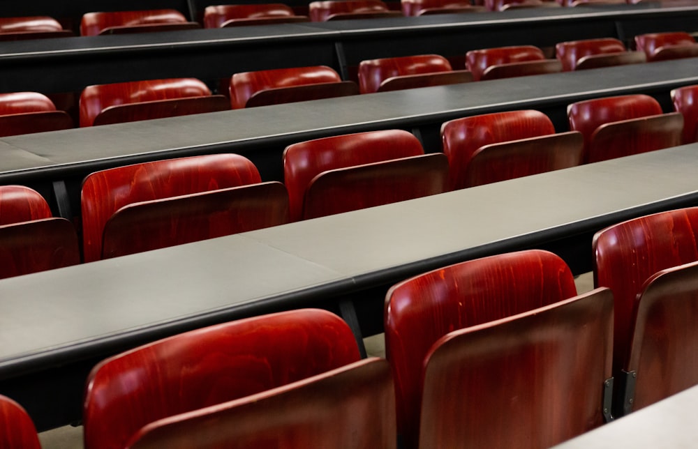 a room full of red chairs