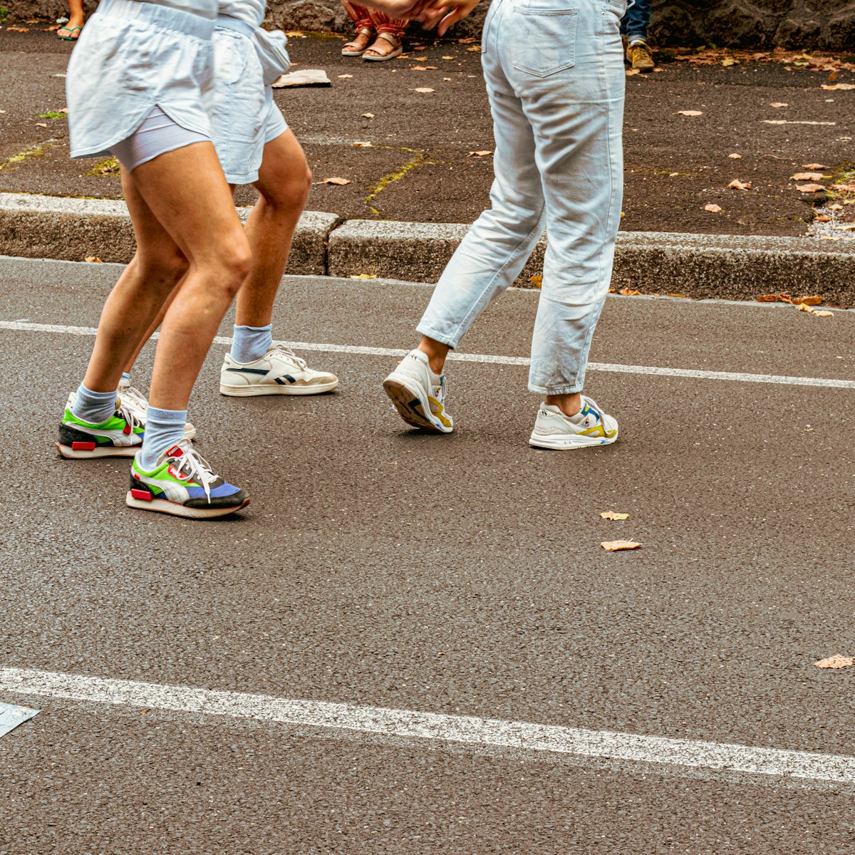 People walking wearing colorful sneakers