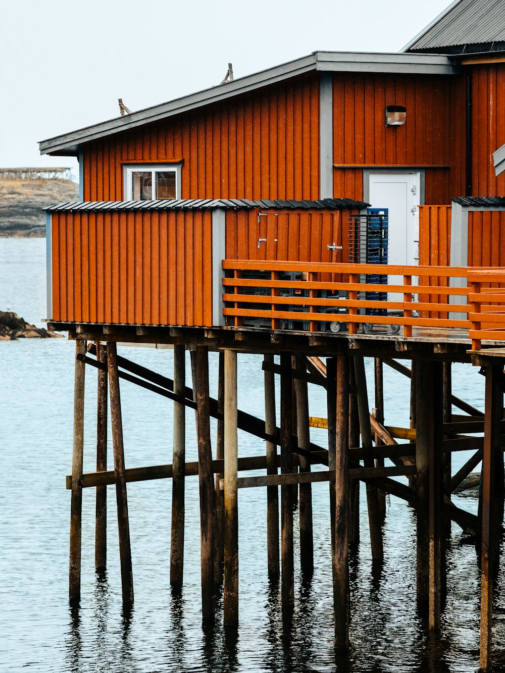 a wooden house on a dock