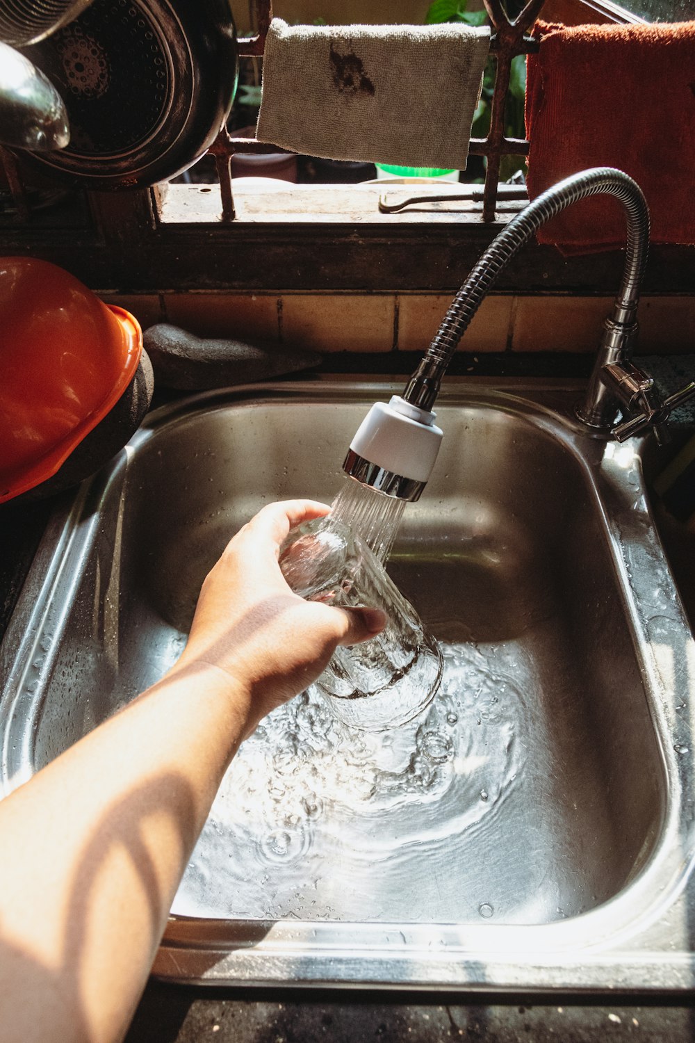 a hand holding a water bottle