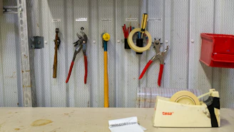a bunch of tools are on a wall