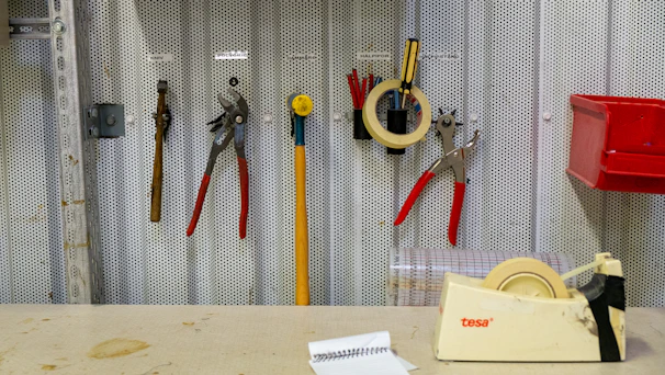 a bunch of tools are on a wall