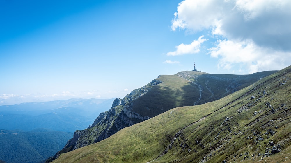 a steep hill with a tower