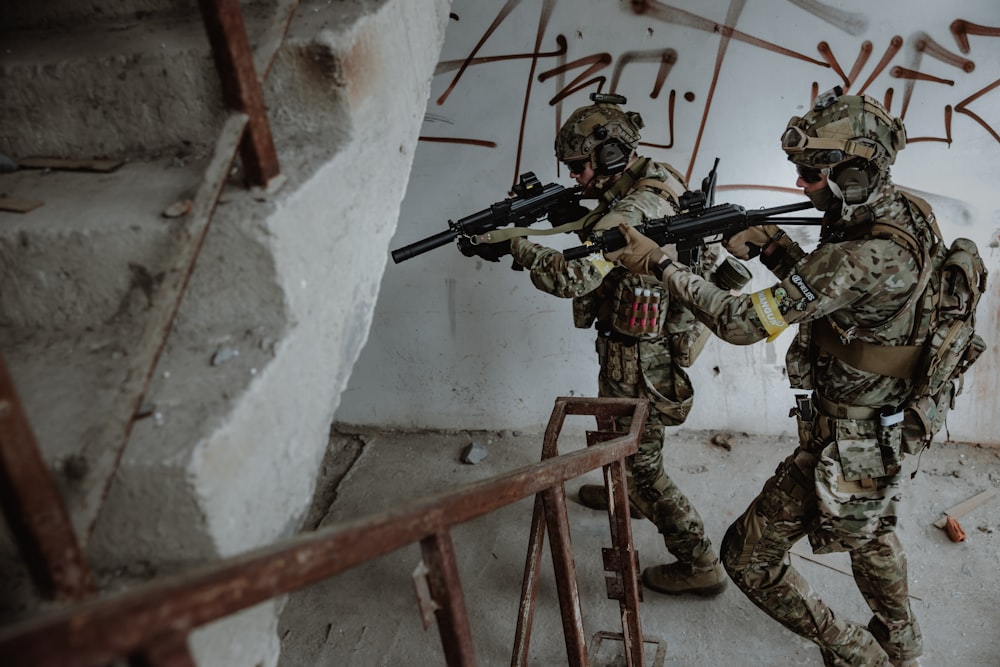 a few soldiers holding guns