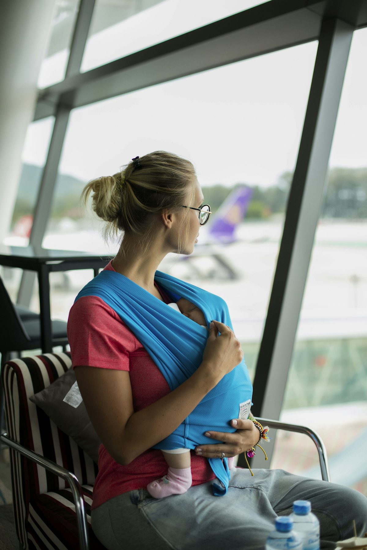 Pregnant traveler at airport departure gate
