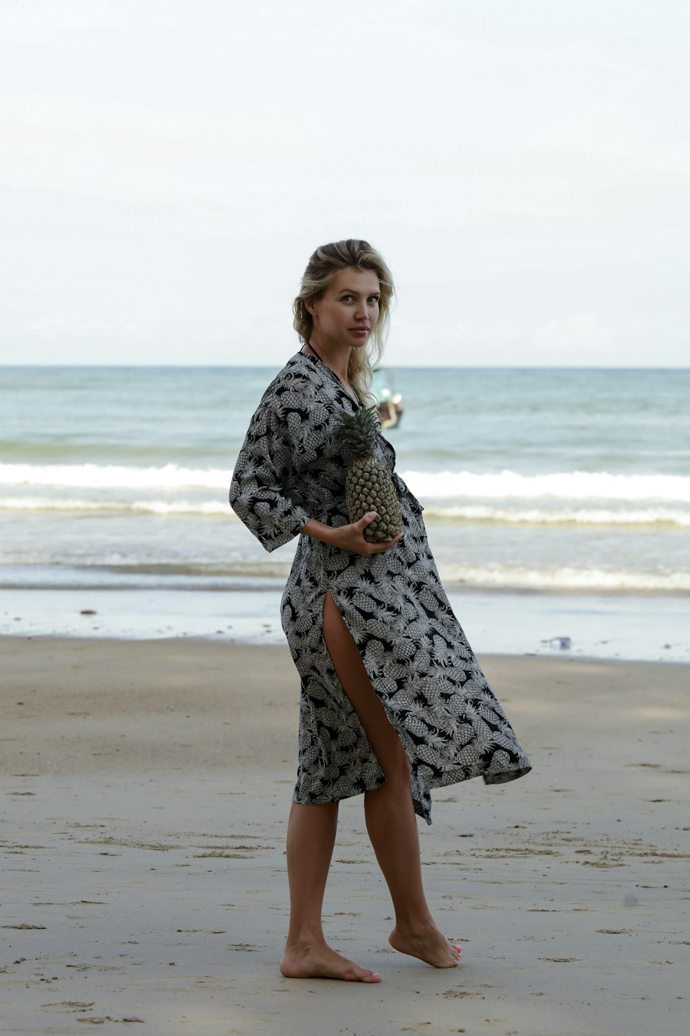 a man in a dress on a beach