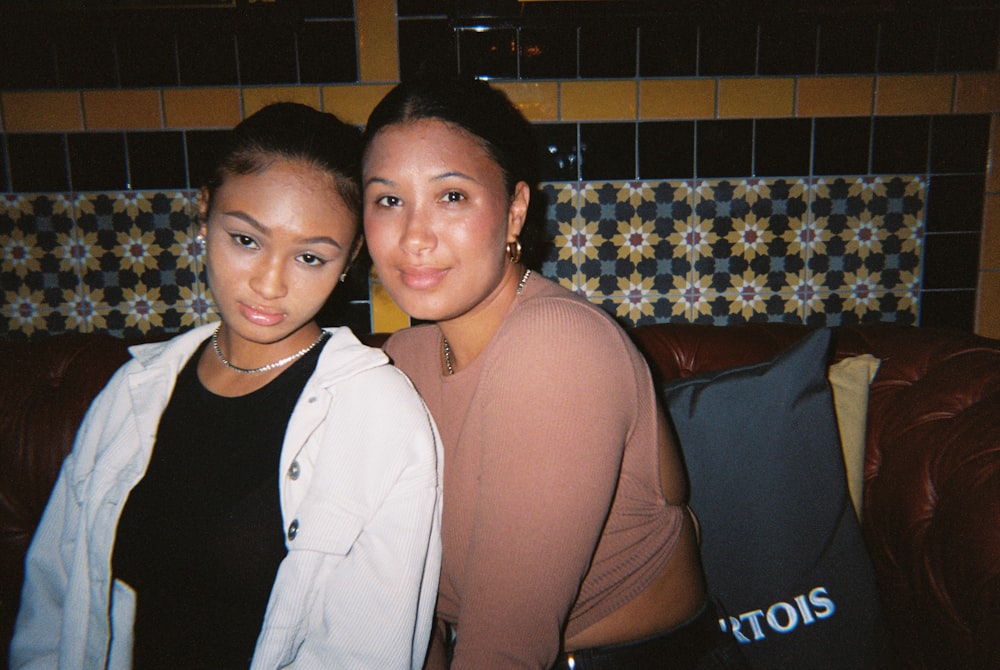 a couple of women posing for the camera