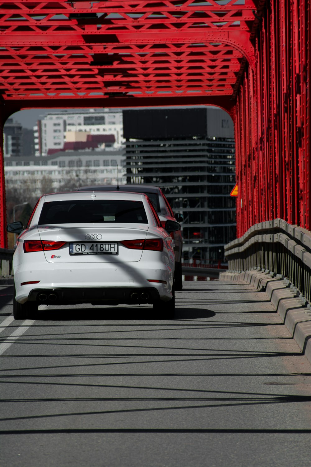 a car driving under a bridge