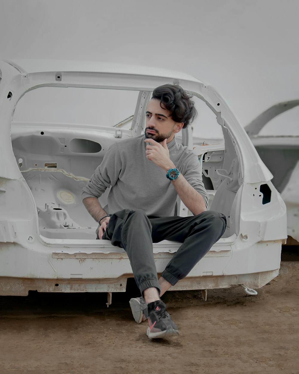 a man sitting in a white vehicle