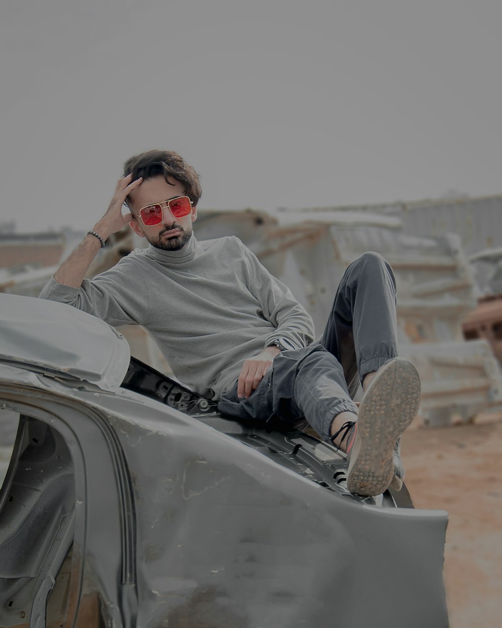 a man sitting on a car