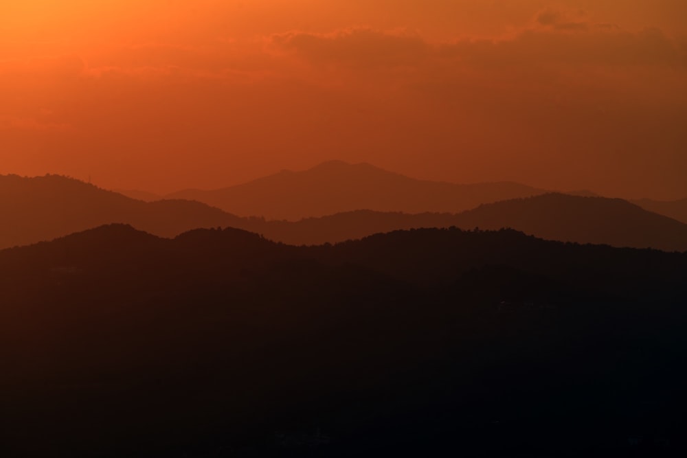 a landscape with hills in the back