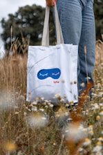 a person holding a white box