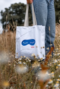 a person holding a white box