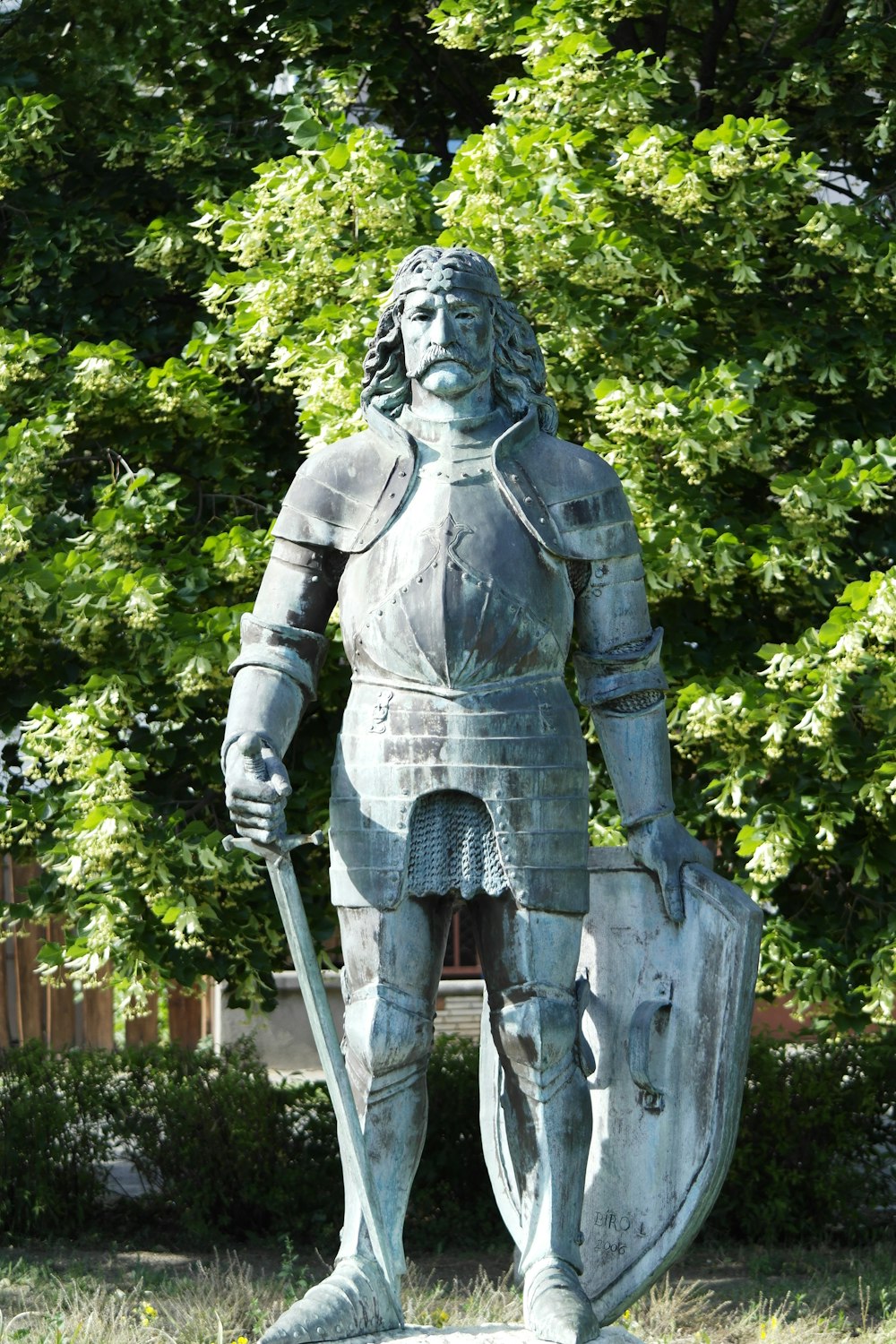 a statue of a person holding a sword