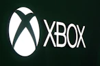 Close-up of the original Xbox console with its distinctive green X logo.