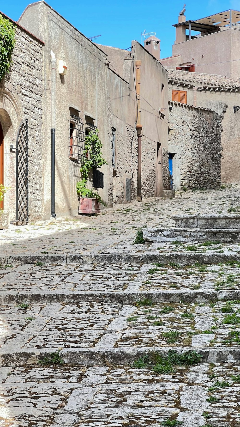 a cobblestone street with buildings on either side of it