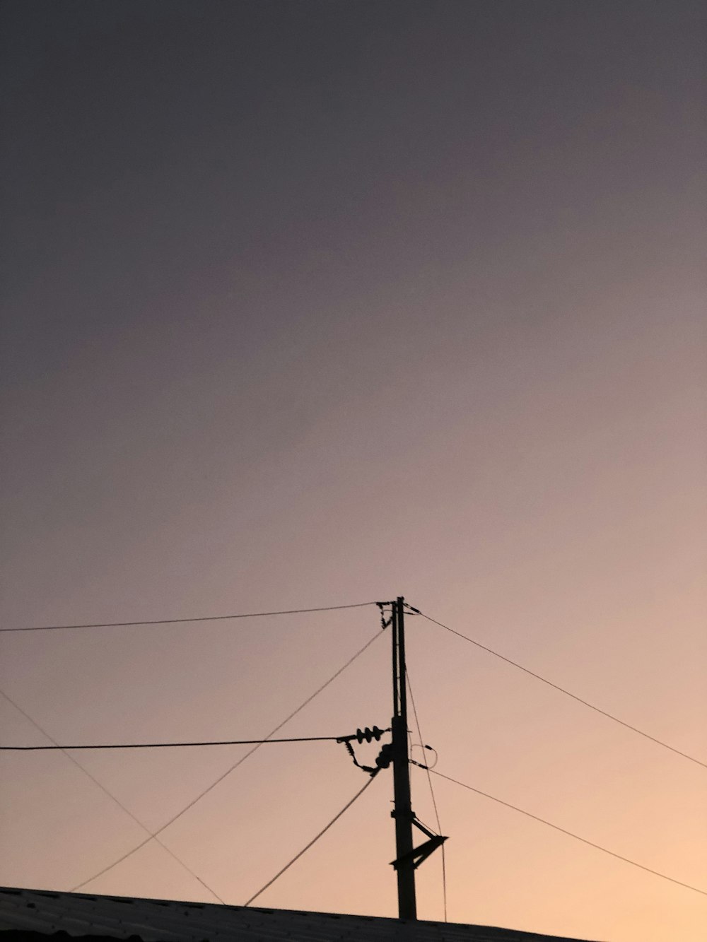 a power line with a blue sky