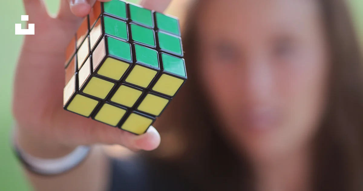 A person holding a cube photo – Free Human Image on Unsplash