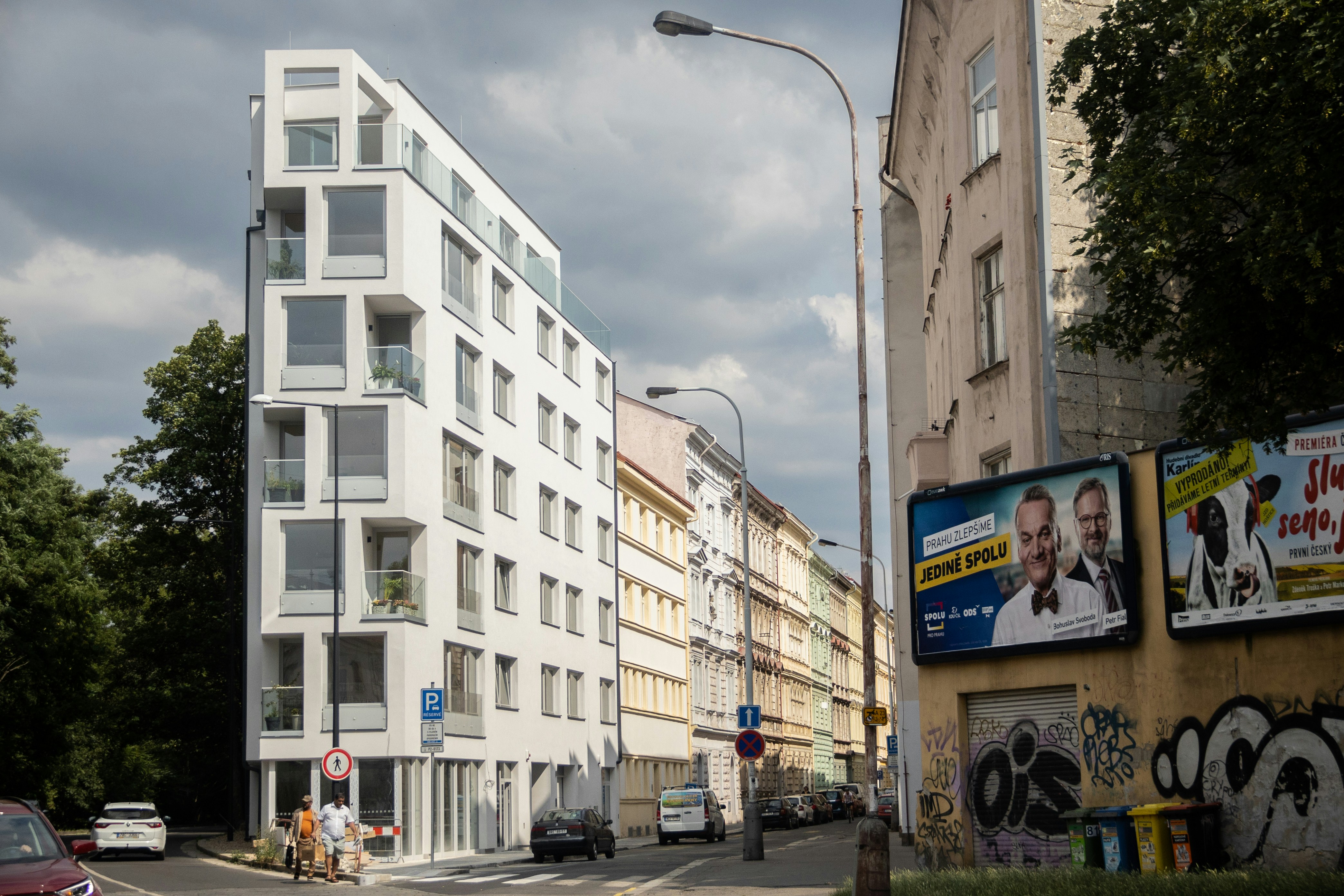 a street with cars and buildings
