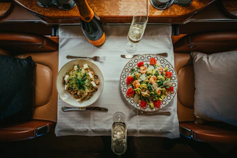 a table with plates of food and glasses on it