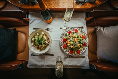 a table with plates of food and glasses on it