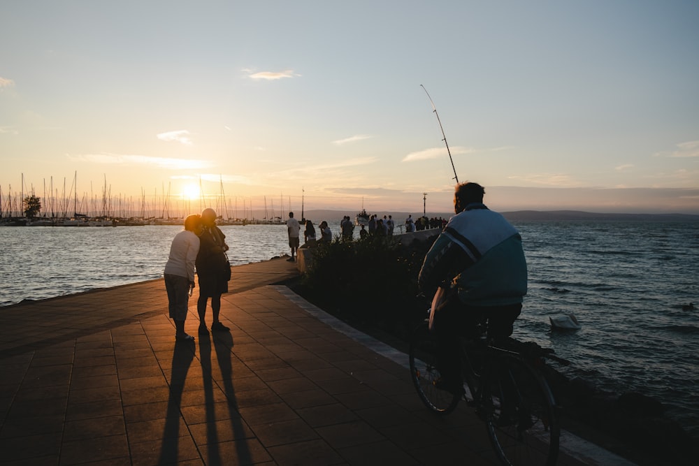 a group of people on a boardwalk