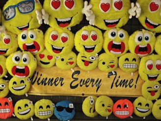 a group of yellow and blue cupcakes with faces on them