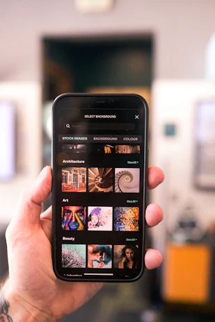 Close-up of a hand selecting options on a smartphone screen featuring the phone finder tool interface.