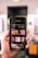 A close-up image of a smartphone being held in a hand, displaying various image categories such as Architecture, Art, and Beauty. The screen shows stock images for background selections, with thumbnails depicting different themes and art styles.