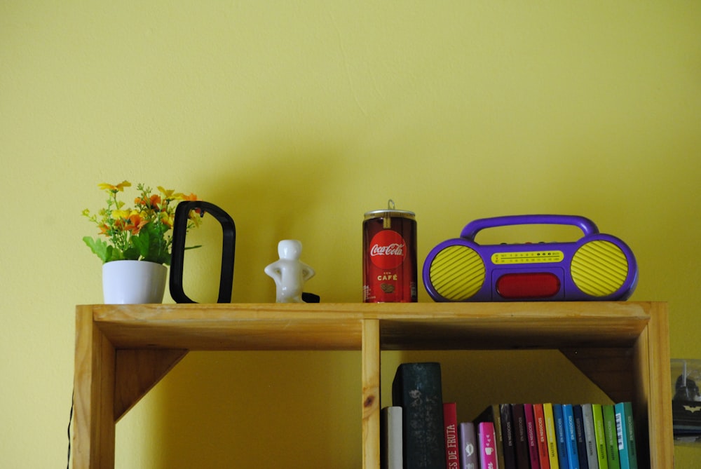 a shelf with a can and a basket on it