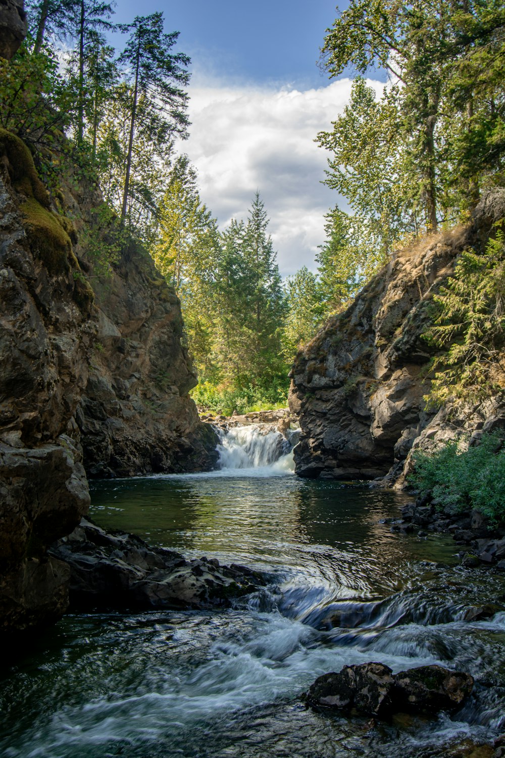 a river flowing between rocky cliffs