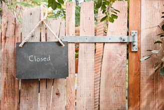 a sign on a fence