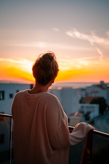 a person looking out a window