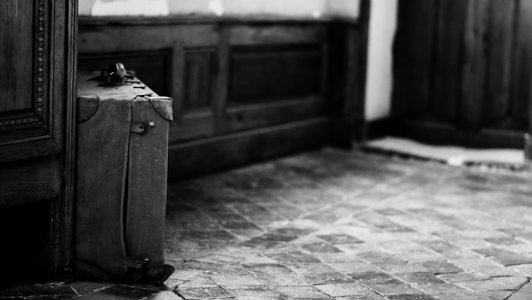 a suitcase sits on the ground,