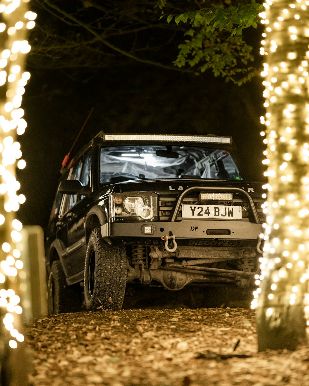 a car parked on a dirt road