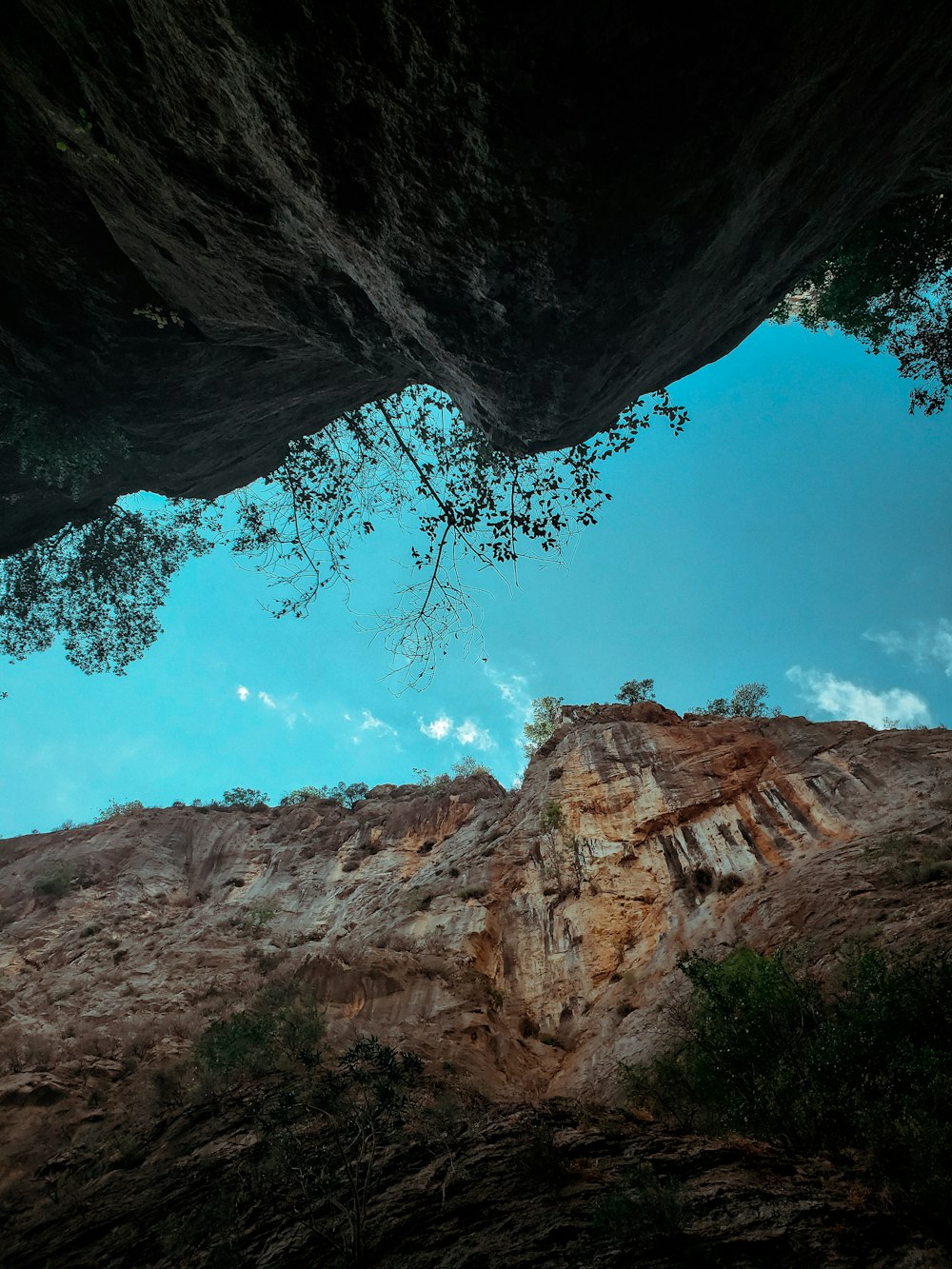 a view of a canyon from inside a cave