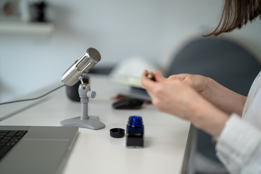 a person using a microscope