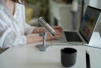A person using a laptop for online notarization with a calm workspace.